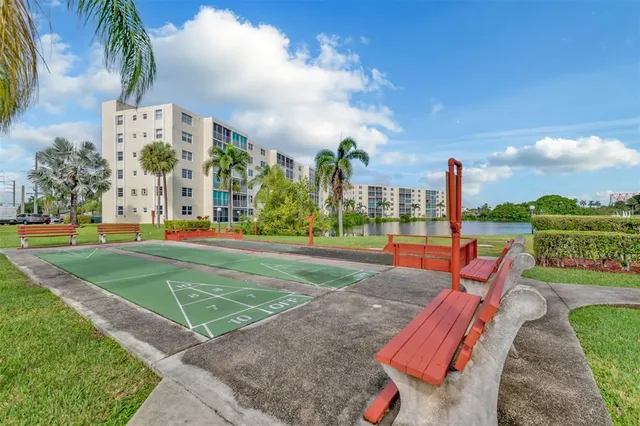 a view of a park with swings and slides
