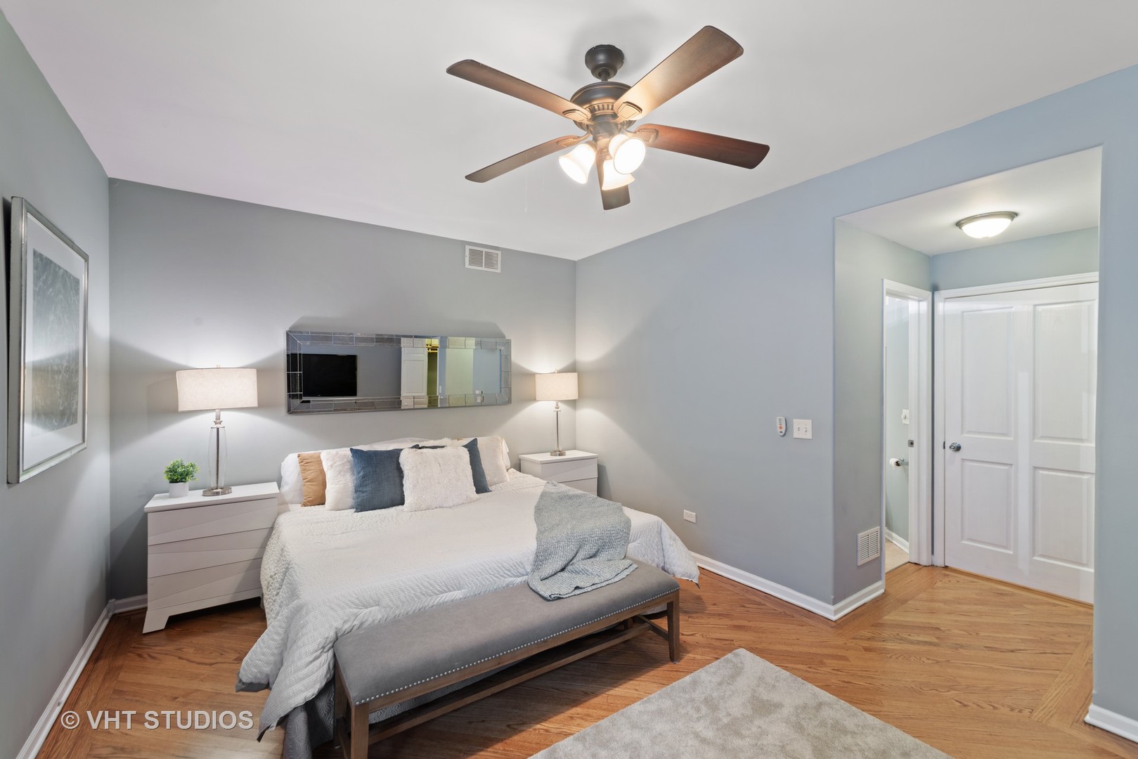 1733 South Ruble Street, Unit 1 Chicago, IL 60616 - Photo 13 of 19 a bedroom with a large bed and a chandelier