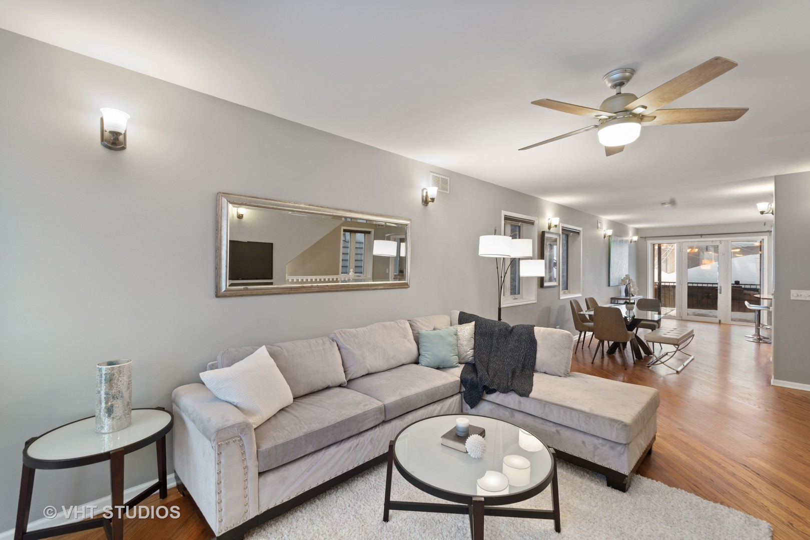 1733 South Ruble Street, Unit 1 Chicago, IL 60616 - Photo 4 of 19 a living room with furniture a ceiling fan and a rug