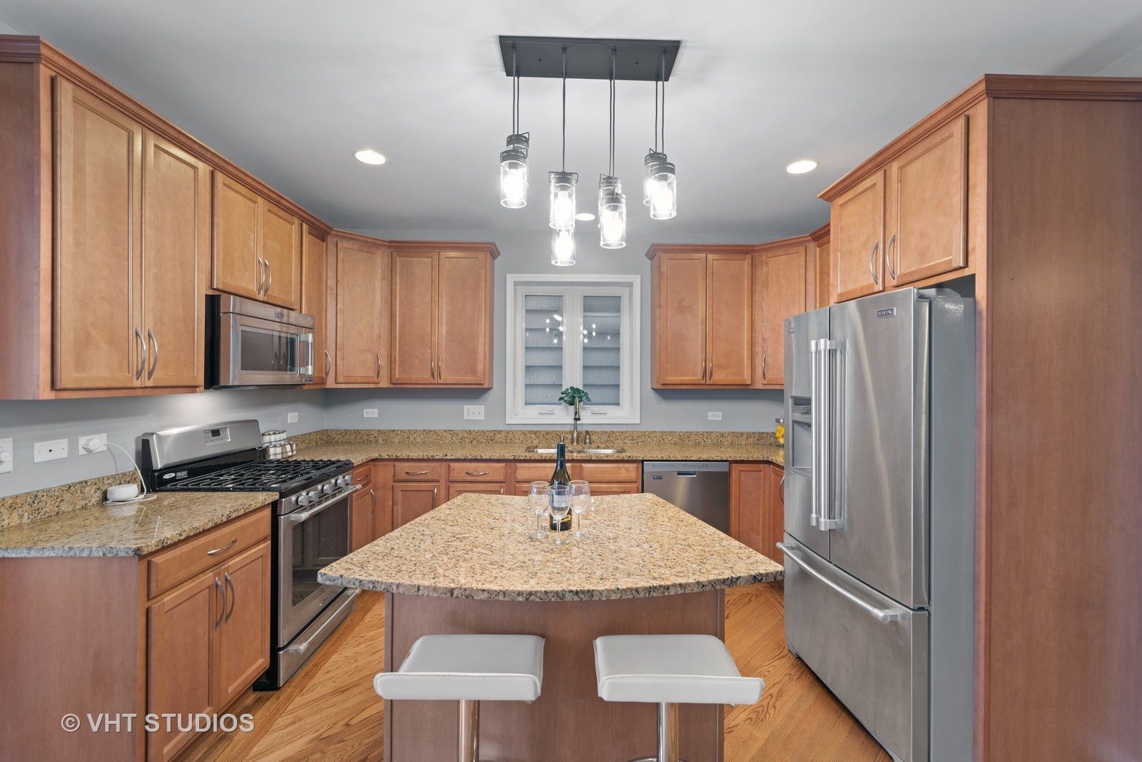 1733 South Ruble Street, Unit 1 Chicago, IL 60616 - Photo 6 of 19 a kitchen with stainless steel appliances granite countertop a sink refrigerator and cabinets