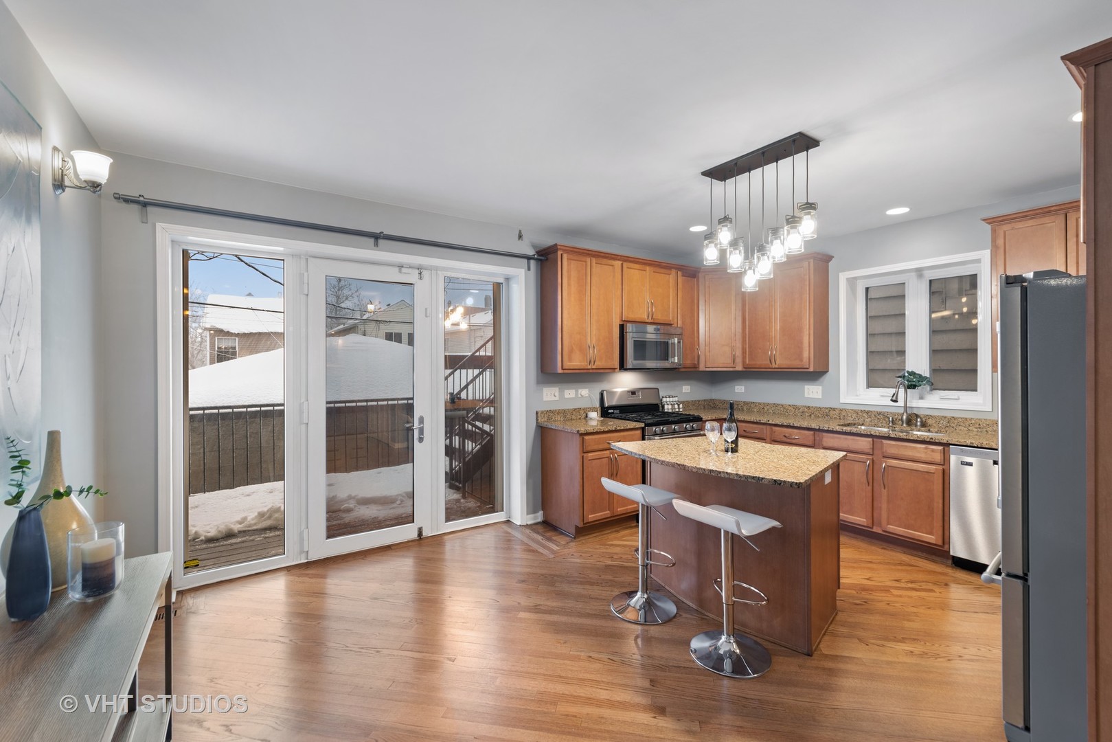 1733 South Ruble Street, Unit 1 Chicago, IL 60616 - Photo 7 of 19 a large kitchen with a large window and wooden floor