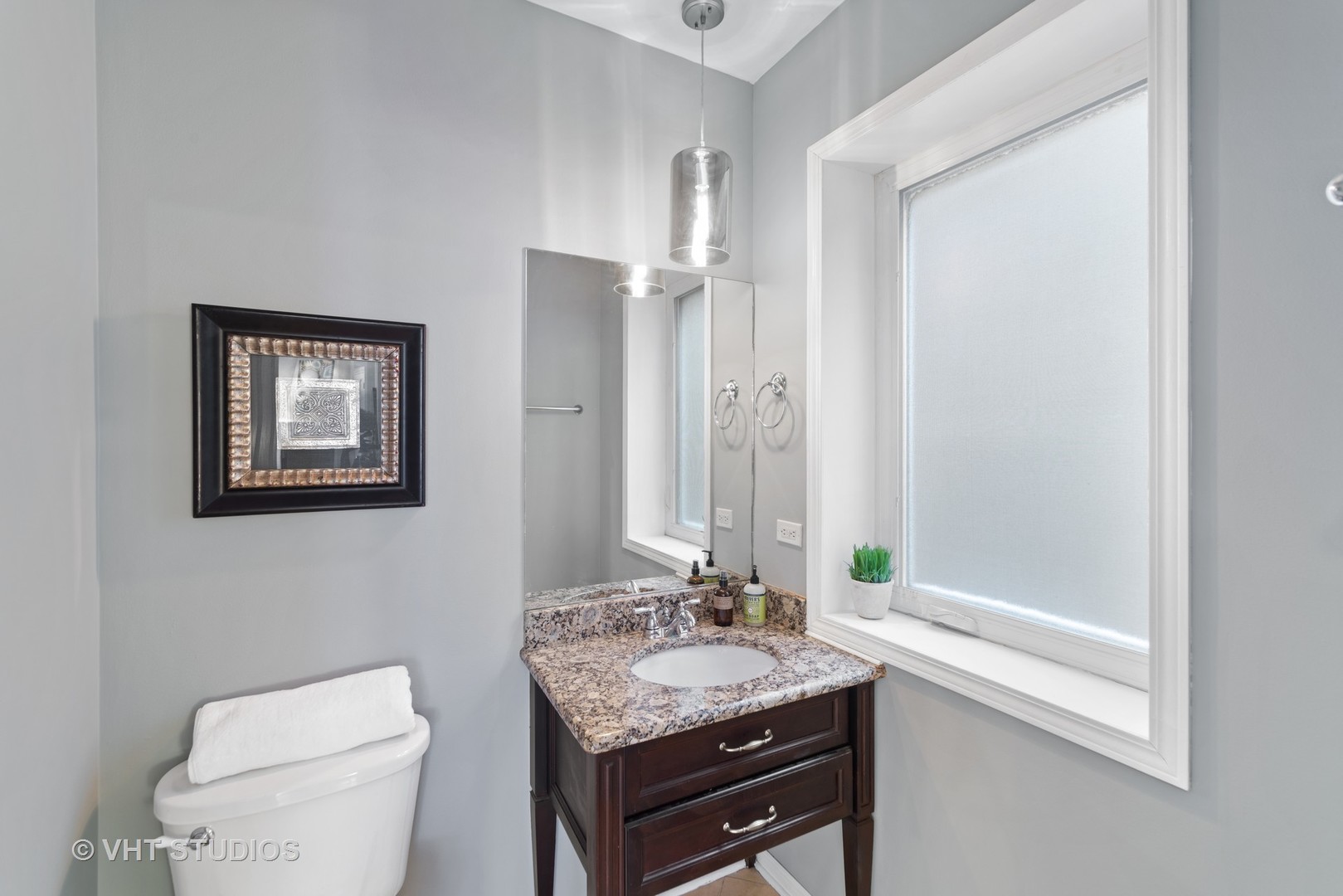 1733 South Ruble Street, Unit 1 Chicago, IL 60616 - Photo 8 of 19 a bathroom with a granite countertop sink a toilet and a shower