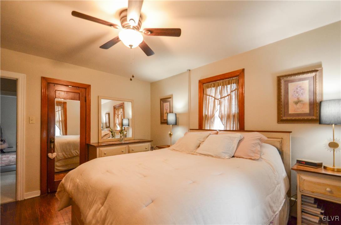 112 Trach Road Kunkletown, PA 18058 - Photo 13 of 33 a bedroom with a large bed and a chandelier