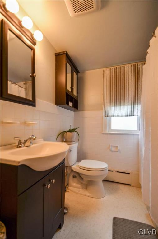 112 Trach Road Kunkletown, PA 18058 - Photo 16 of 33 a bathroom with a double vanity sink toilet and mirror