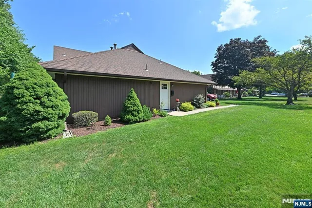 a view of a house with a yard porch and sitting area
