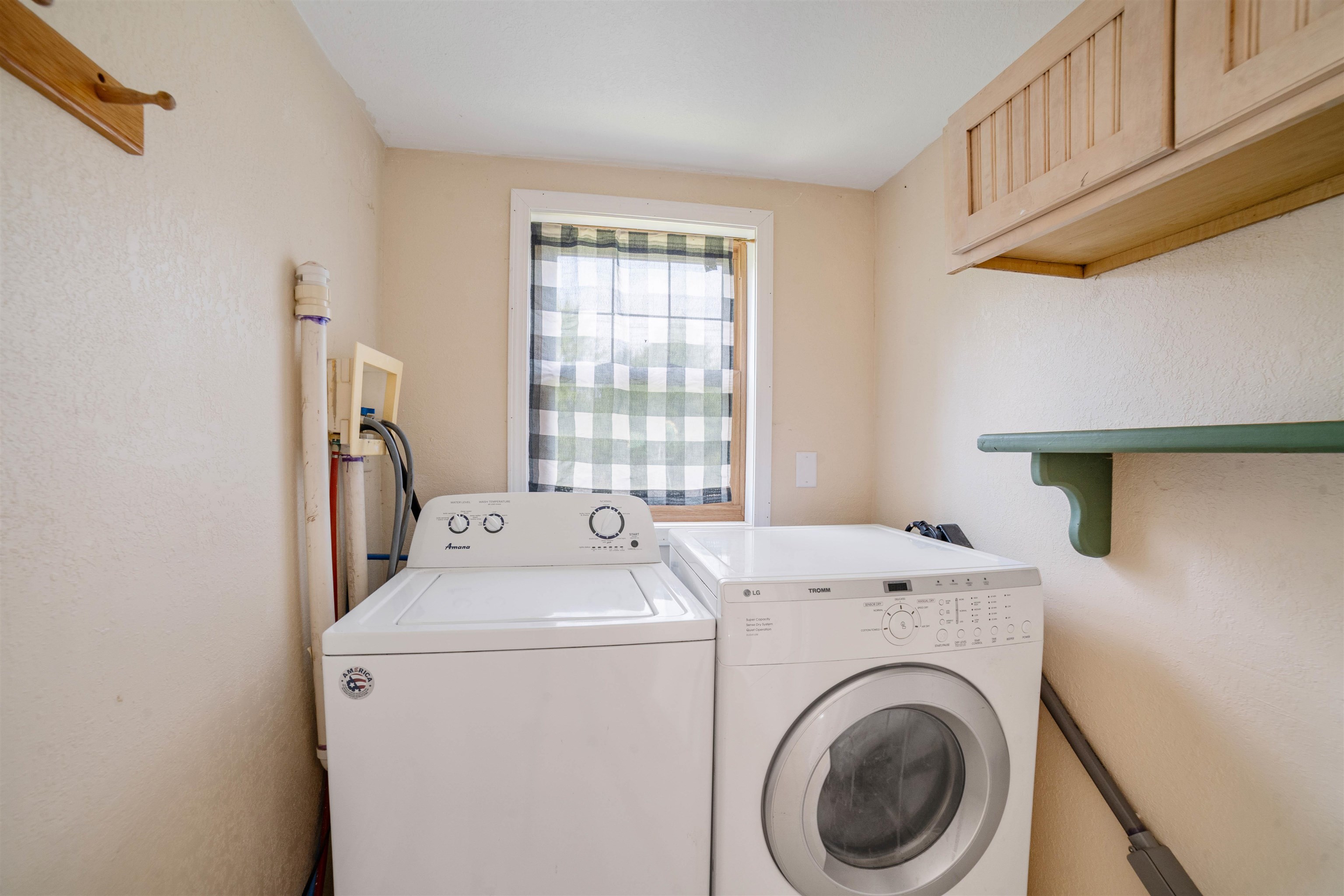 9372 McCamus Road Brookston, MN 55711 - Photo 22 of 49 Washroom featuring cabinet space and washing machine and clothes dryer