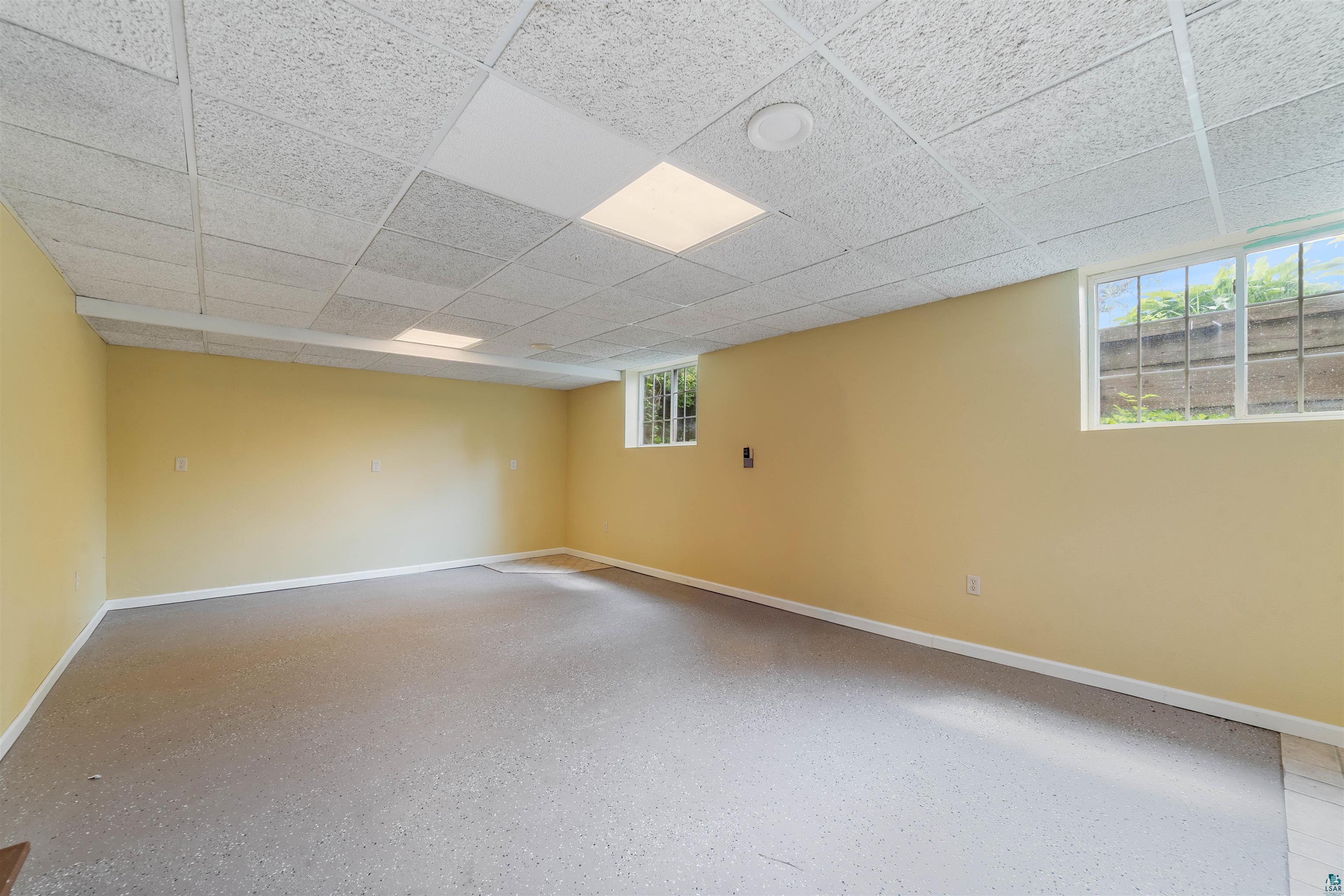 9372 McCamus Road Brookston, MN 55711 - Photo 36 of 49 Unfurnished room featuring a drop ceiling and baseboards