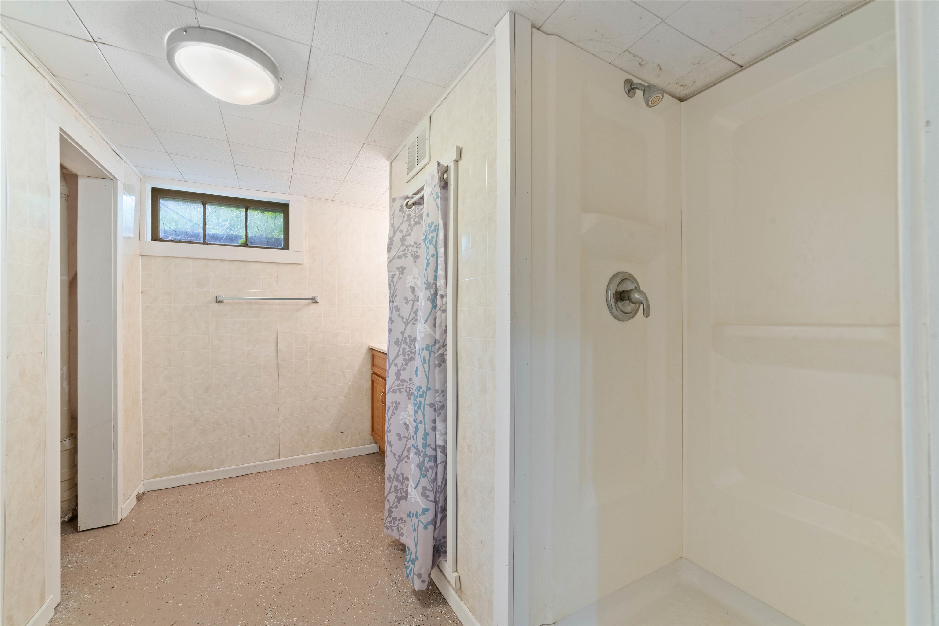 9372 McCamus Road Brookston, MN 55711 - Photo 38 of 49 Full bathroom featuring a stall shower and baseboards