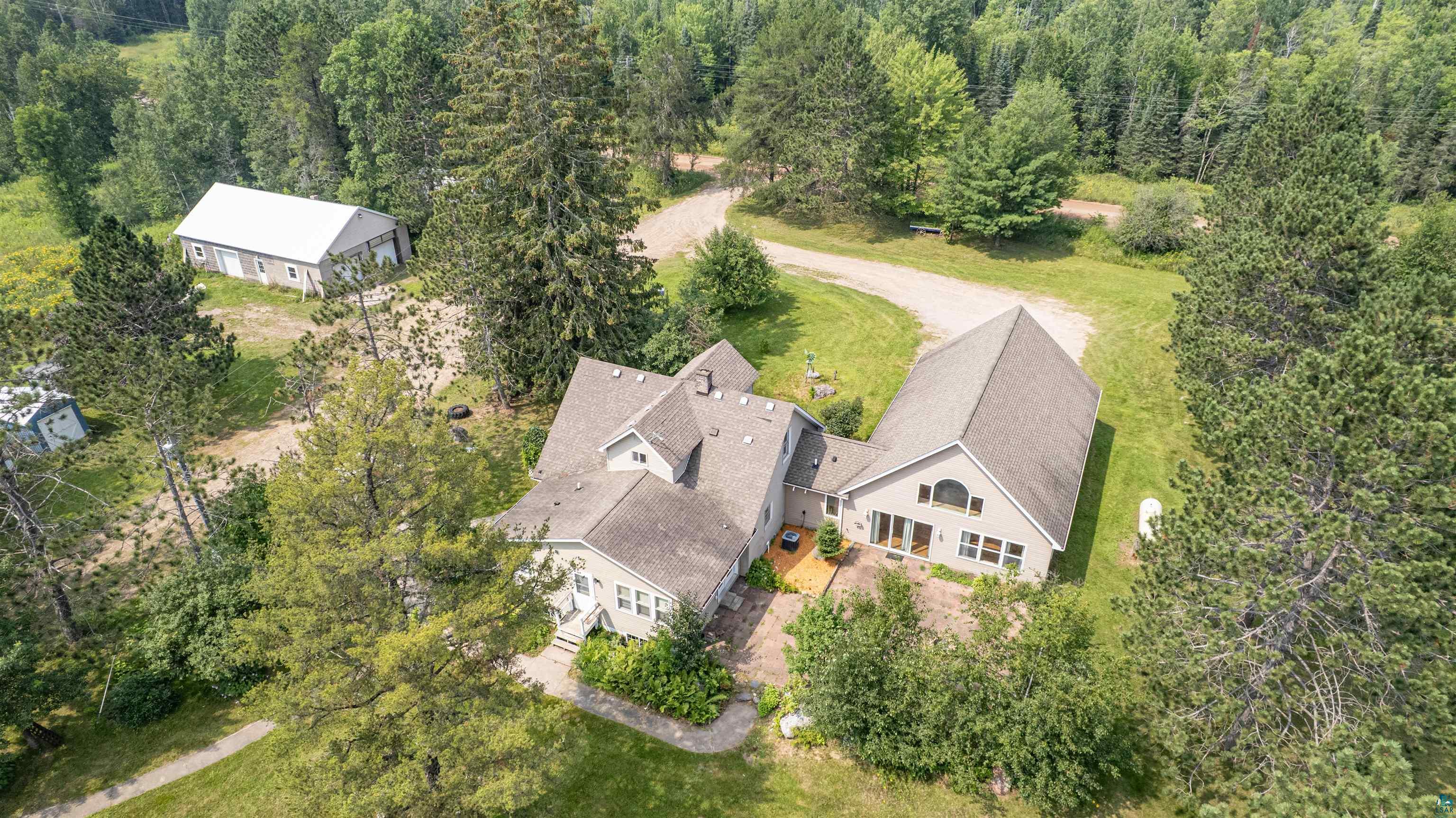9372 McCamus Road Brookston, MN 55711 - Photo 4 of 49 Aerial view of property and surrounding area featuring a forest