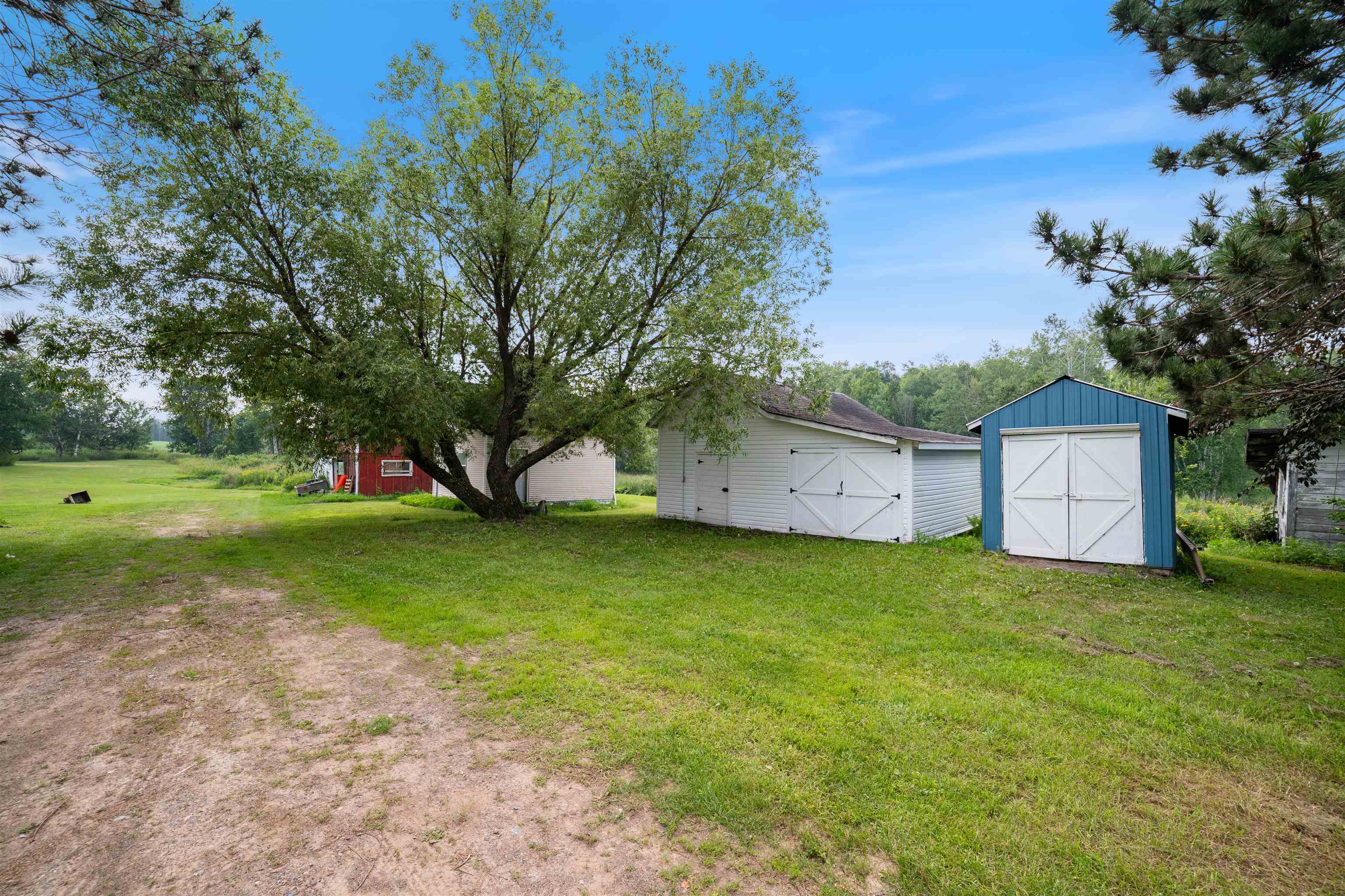 9372 McCamus Road Brookston, MN 55711 - Photo 41 of 49 View of green lawn featuring a storage shed