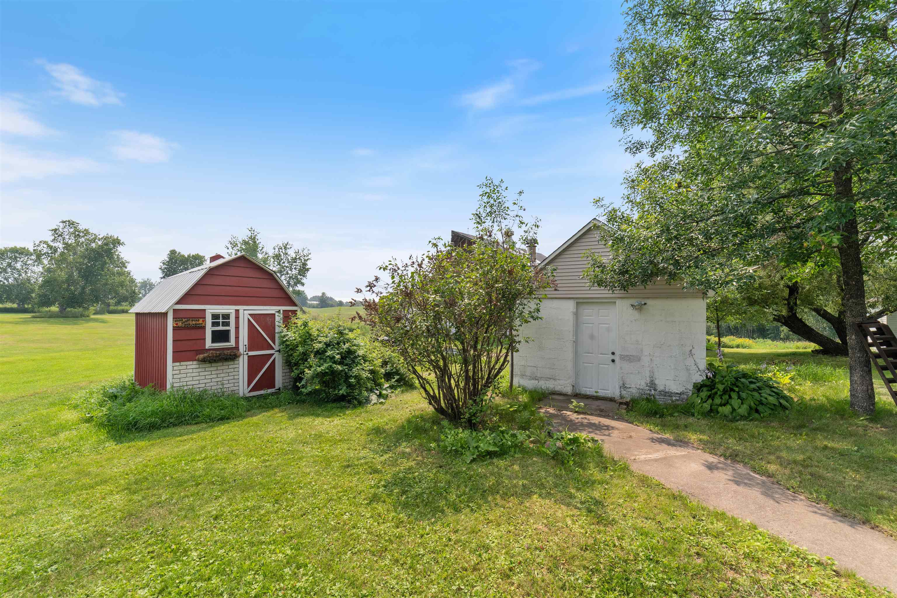 9372 McCamus Road Brookston, MN 55711 - Photo 45 of 49 View of green lawn featuring an outdoor structure and a barn