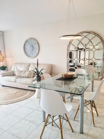 a kitchen with a table and chairs in it