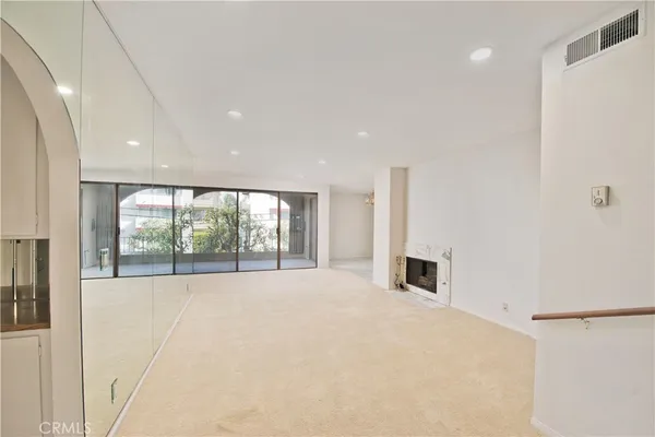 a view of an empty room with a balcony