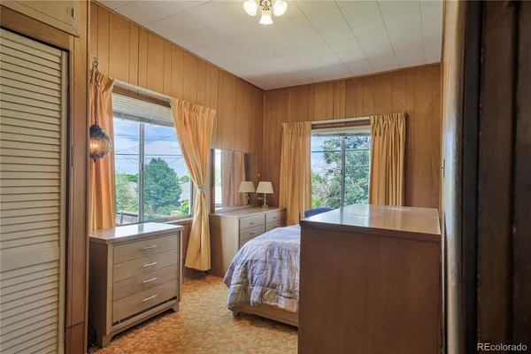 a bed room with a bed and a window