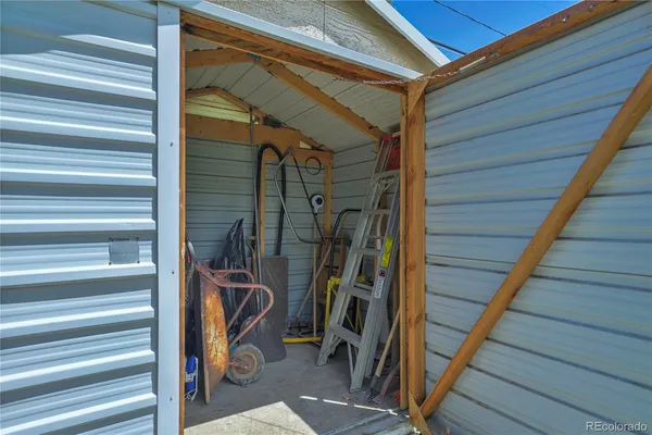 a view of a house with a yard and plants