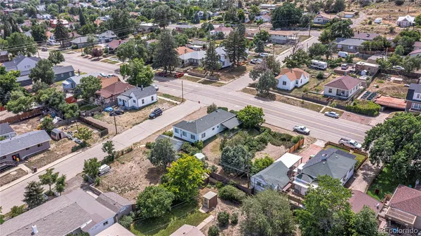 an aerial view of residential houses with outdoor space