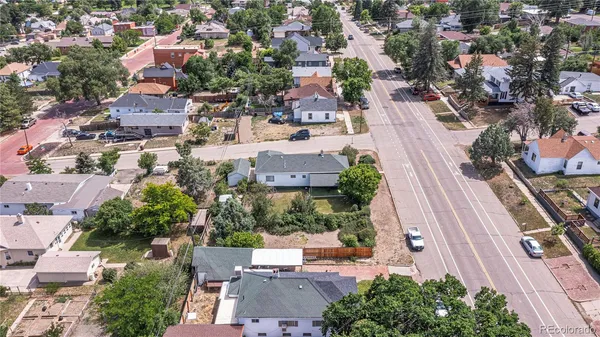an aerial view of residential houses with outdoor space