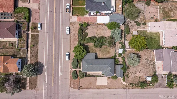 an aerial view of a house with outdoor space