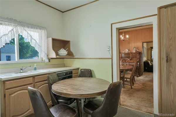 a dining room with furniture and window