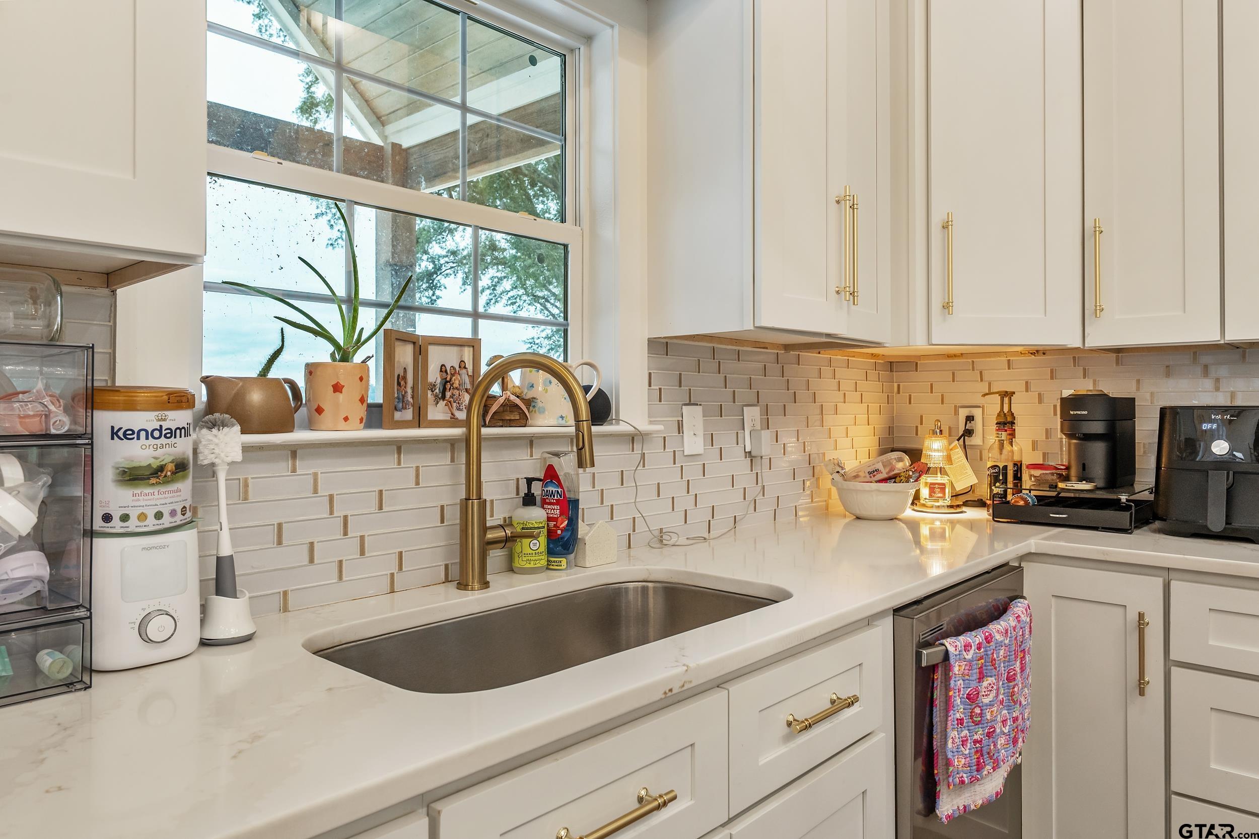 16837 Wilson Road Tyler, TX 75707 - Photo 17 of 44 a kitchen with stainless steel appliances granite countertop a sink and cabinets