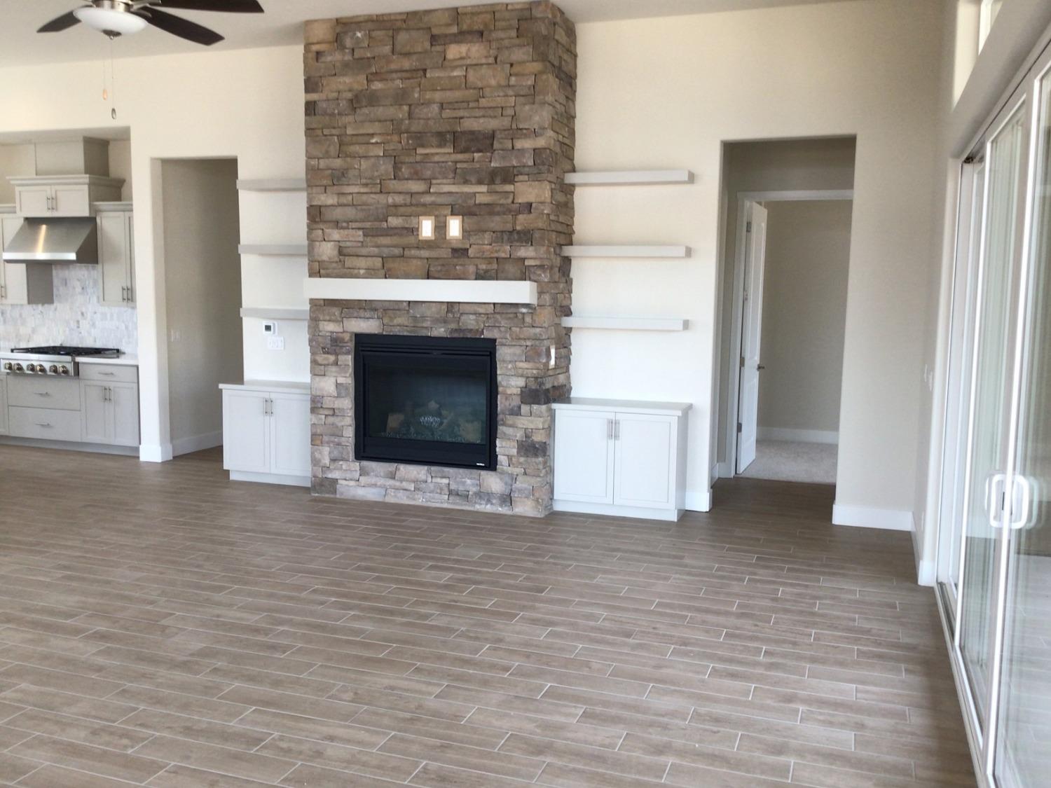 969 Ridgeline Road Madera, CA 93636 - Photo 5 of 16 a view of a livingroom with an empty space and a fireplace