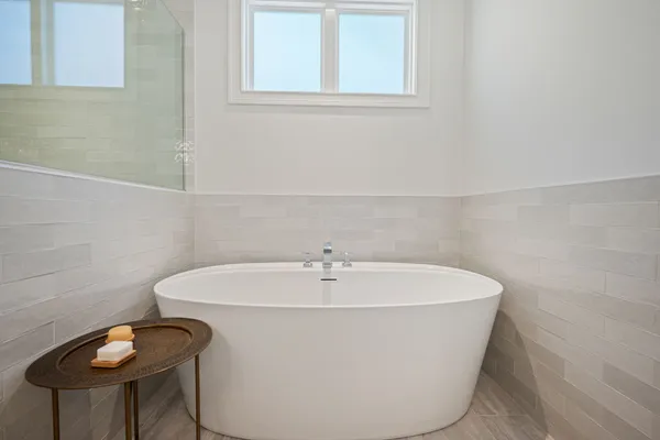 a white bath tub sitting in a bathroom