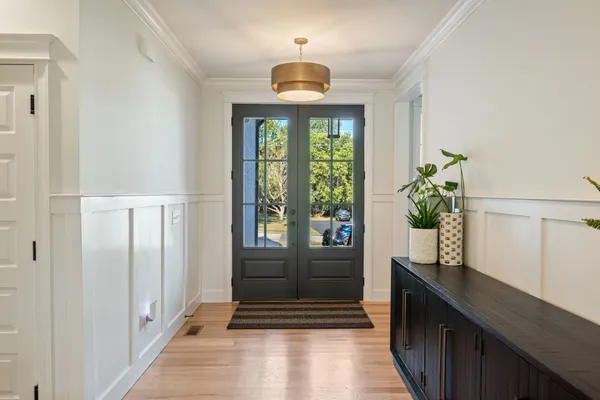 a view of entryway with wooden floor