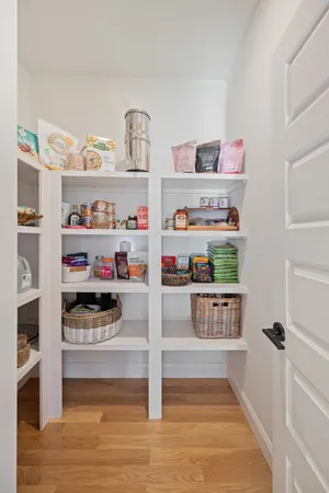a front view of a house with potted plants