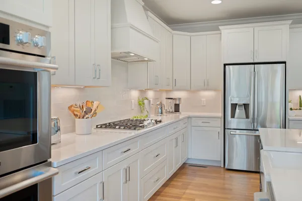 a kitchen with a refrigerator and a sink