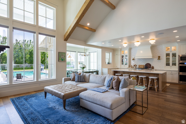 630 East Center Street Alpine, UT 84004 - Photo 37 of 115 Open-concept living space featuring vaulted ceilings with exposed wood beams