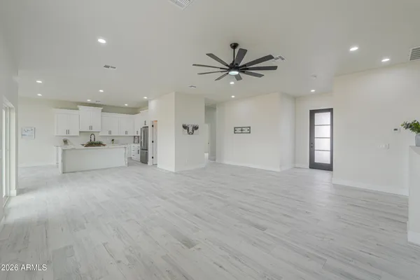 a kitchen with stainless steel appliances a stove a sink and a refrigerator