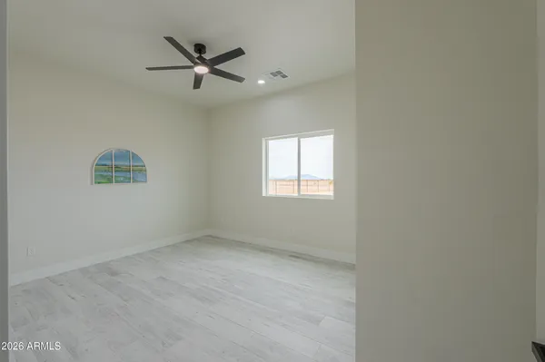 a bathroom with a toilet a sink and shower