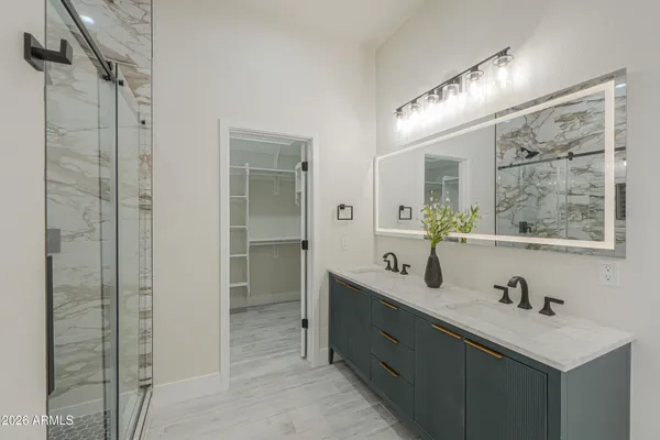 a view of big house with yard and front view of house