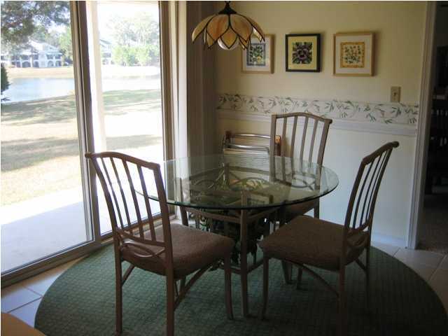 107 Bermuda Way Niceville, FL 32578 - Photo 15 of 19 a view of a dining room with furniture window and wooden floor