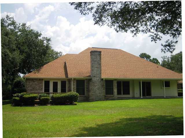 107 Bermuda Way Niceville, FL 32578 - Photo 16 of 19 a front view of a house with a garden