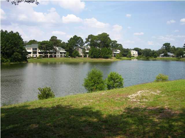 107 Bermuda Way Niceville, FL 32578 - Photo 17 of 19 a view of a lake with houses in the back