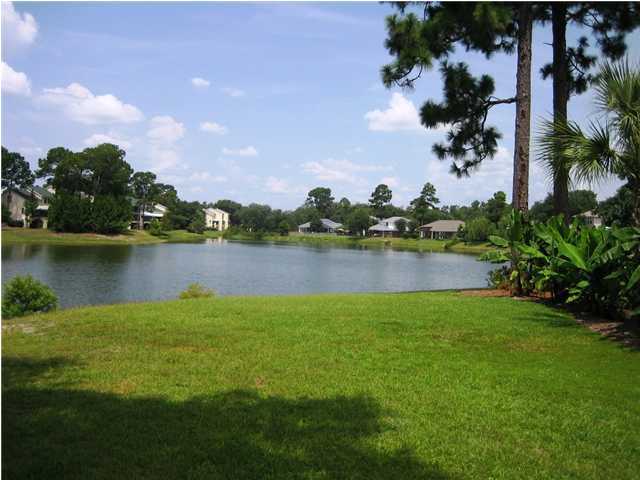 107 Bermuda Way Niceville, FL 32578 - Photo 18 of 19 a view of a lake with houses in the back
