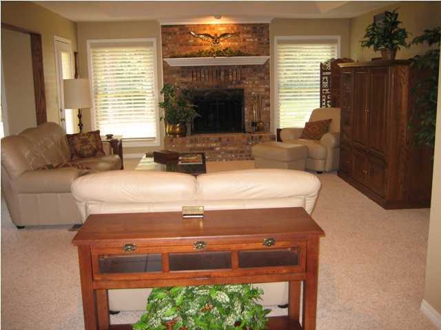 107 Bermuda Way Niceville, FL 32578 - Photo 3 of 19 a living room with furniture and a fireplace