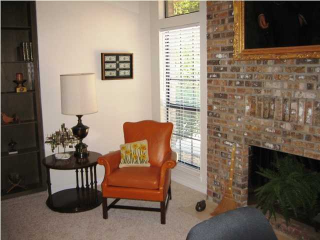 107 Bermuda Way Niceville, FL 32578 - Photo 8 of 19 a outdoor living room with furniture and a fireplace