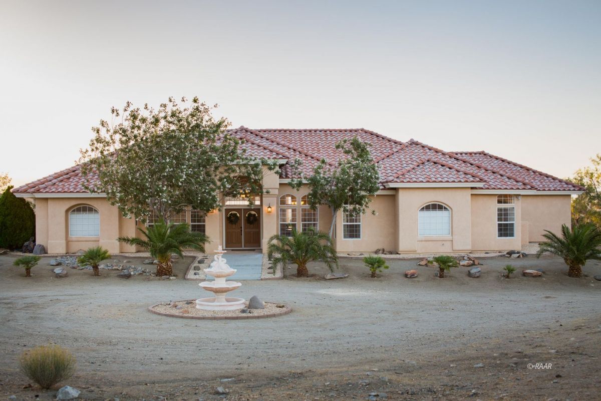 2851 Lauron Court Ridgecrest, CA 93555 - Photo 1 of 1 a front view of a house with a garden