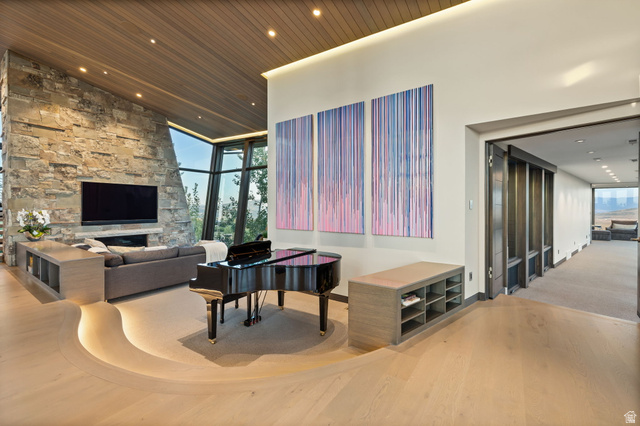 8544 North Promontory Ranch Road Park City, UT 84098 - Photo 14 of 36 Living area featuring light wood-type flooring, expansive windows, recessed lighting, and a high wooden ceiling
