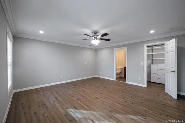 a view of bathroom with a toilet a sink and a mirror