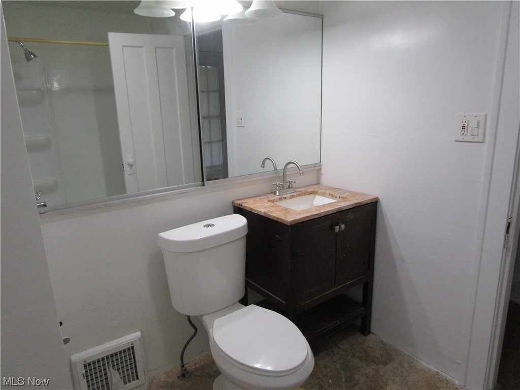 3796 Lowell Road Cleveland Heights, OH 44121 - Photo 9 of 11 Bathroom with tile floors, vanity, toilet, and walk in shower