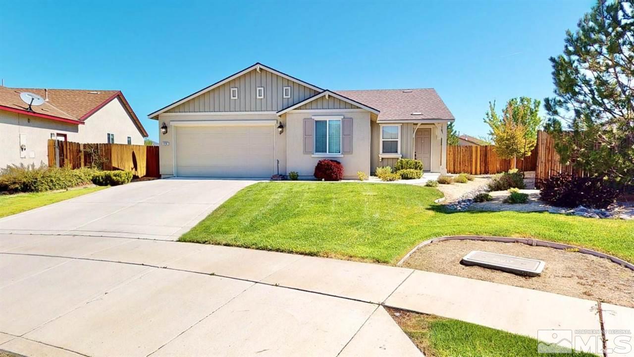 9196 Raytheon Court Reno, NV 89506 - Photo 1 of 23 a front view of house with yard and green space