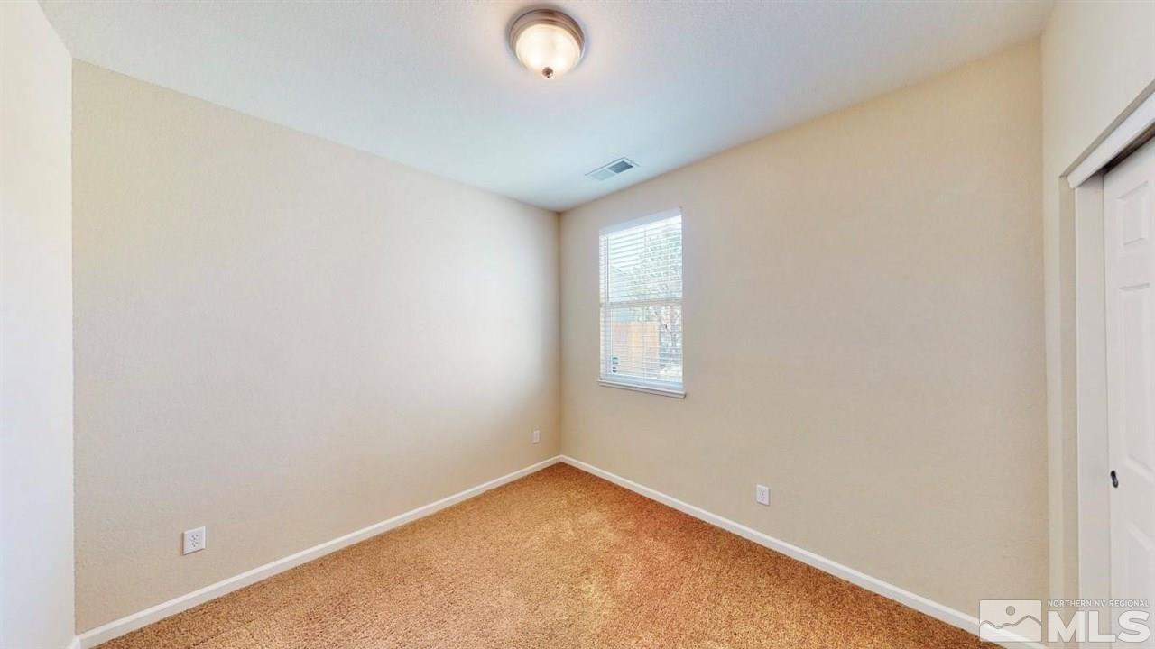 9196 Raytheon Court Reno, NV 89506 - Photo 12 of 23 an empty room with windows