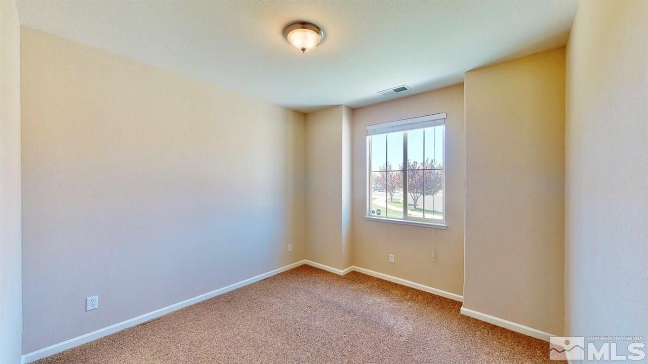9196 Raytheon Court Reno, NV 89506 - Photo 14 of 23 an empty room with a window