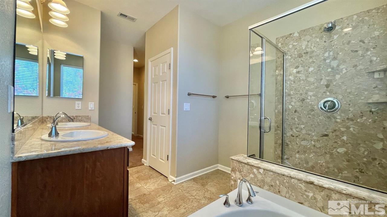 9196 Raytheon Court Reno, NV 89506 - Photo 21 of 23 a bathroom with a sink and a mirror