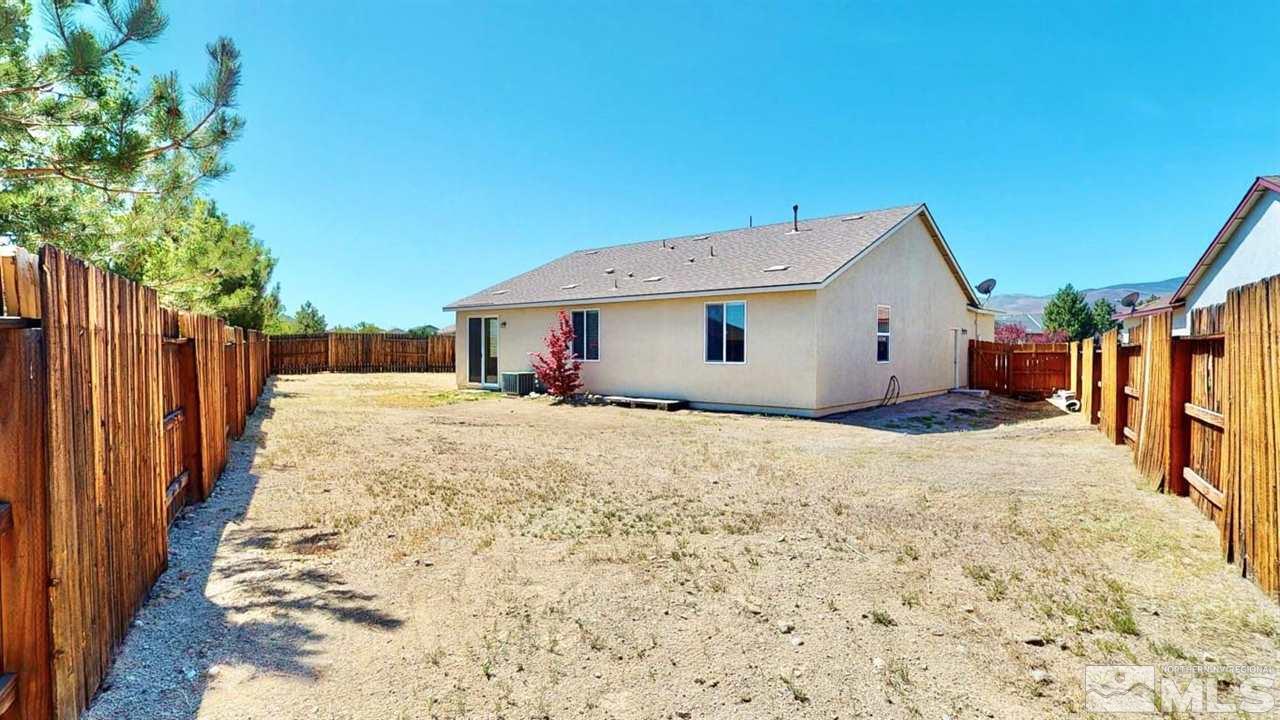 9196 Raytheon Court Reno, NV 89506 - Photo 23 of 23 a view of a house with a wooden fence