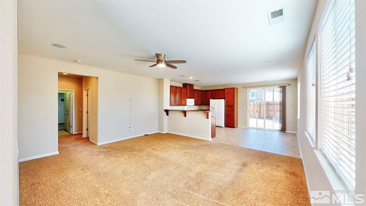 9196 Raytheon Court Reno, NV 89506 - Photo 9 of 23 a view of a kitchen with a sink and a window