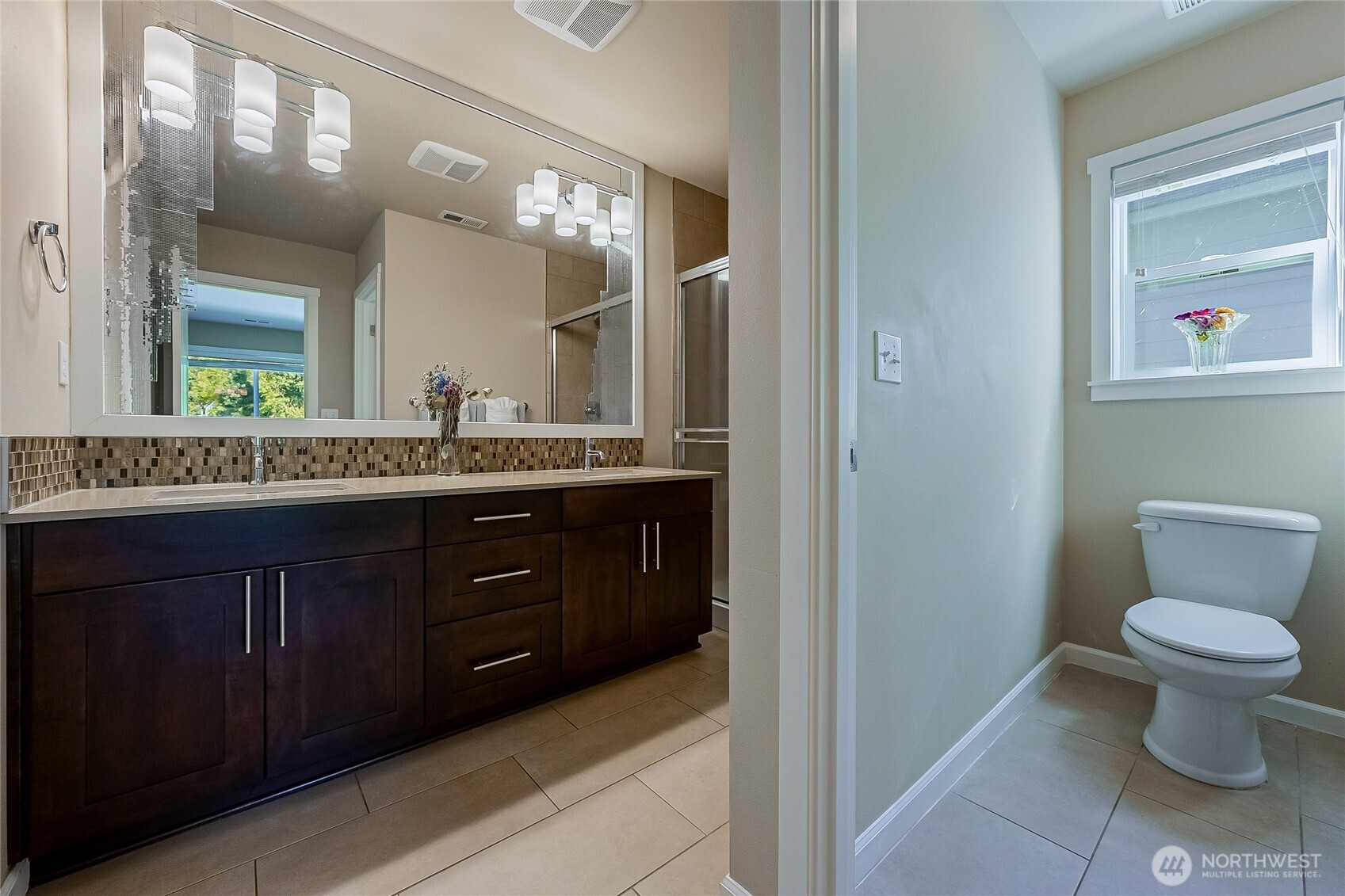 11501 87th Avenue South Seattle, WA 98178 - Photo 14 of 30 a bathroom with a granite countertop toilet sink and mirror